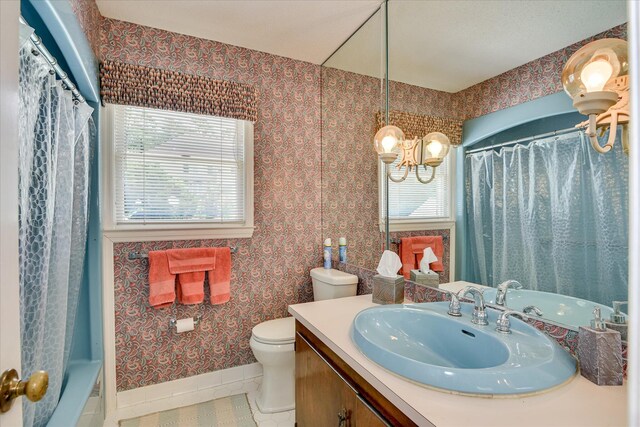 804 Camellia Rd, Augusta, GA 30909 - full bath featuring tile patterned floors, vanity, a chandelier, shower / bath combo with shower curtain, and wallpapered walls