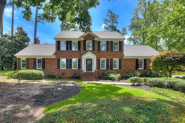804 Camellia Rd, Augusta, GA 30909 - view of front of home featuring brick siding, a front lawn, a chimney, and crawl space