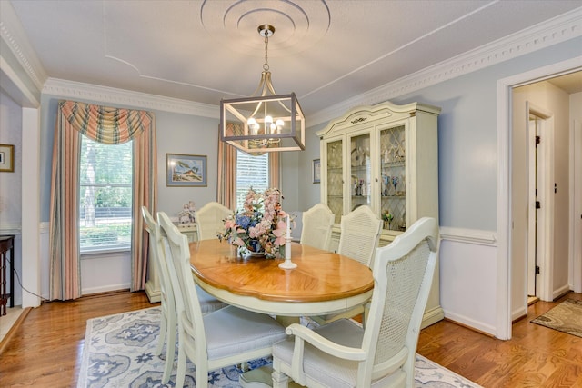 804 Camellia Rd, Augusta, GA 30909 - dining area with a chandelier, ornamental molding, and wood finished floors