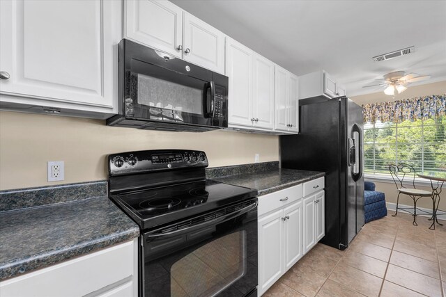 104 Sim St, Washington, GA 30673 - kitchen featuring black appliances, white cabinets, and dark countertops
