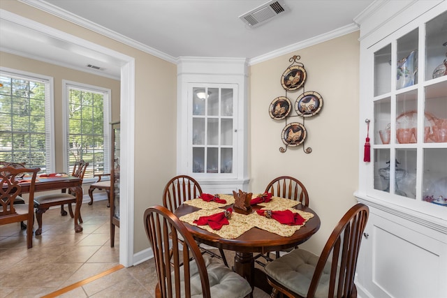 104 Sim St, Washington, GA 30673 - dining space featuring crown molding, light tile patterned floors, and baseboards