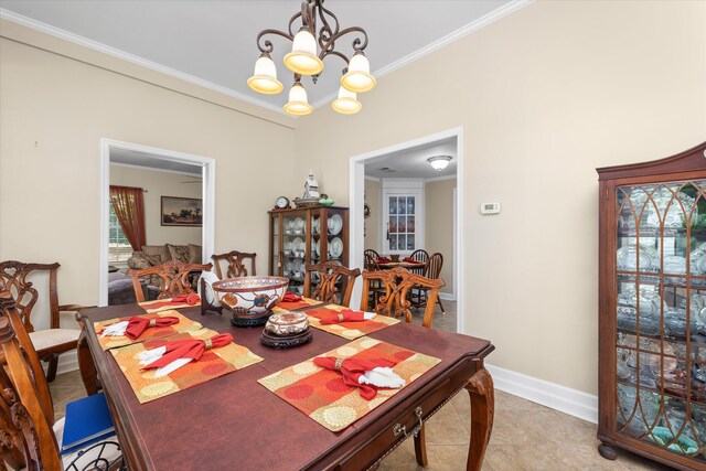 104 Sim St, Washington, GA 30673 - dining space featuring a chandelier, crown molding, baseboards, and light tile patterned floors