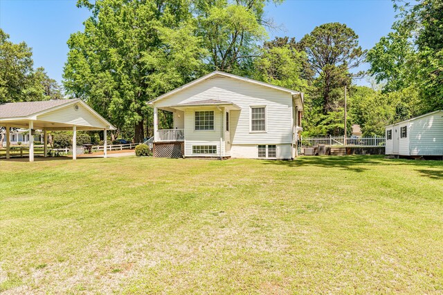 104 Sim St, Washington, GA 30673 - back of property with a yard and view of scattered trees