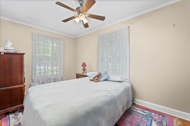 104 Sim St, Washington, GA 30673 - bedroom featuring ornamental molding, baseboards, wood finished floors, and ceiling fan