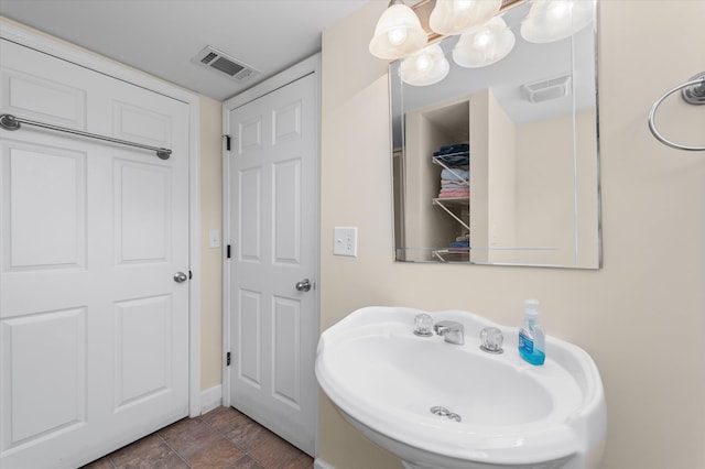 104 Sim St, Washington, GA 30673 - bathroom featuring a sink and baseboards