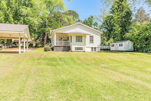 104 Sim St, Washington, GA 30673 - rear view of house with a lawn, covered porch, central AC unit, and view of wooded area