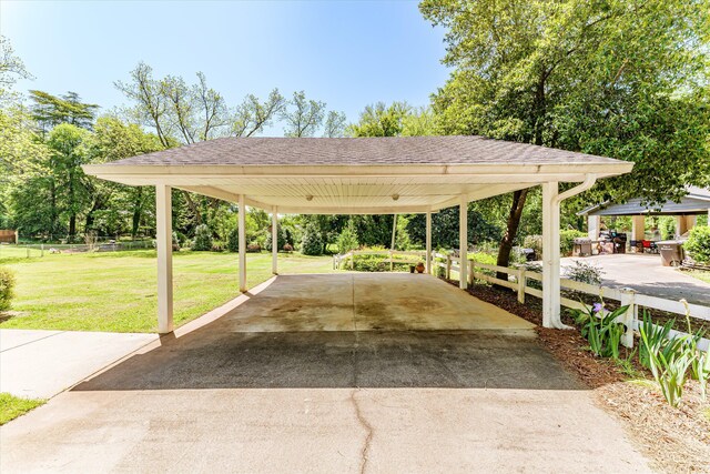 104 Sim St, Washington, GA 30673 - view of home's community featuring asphalt driveway and a carport