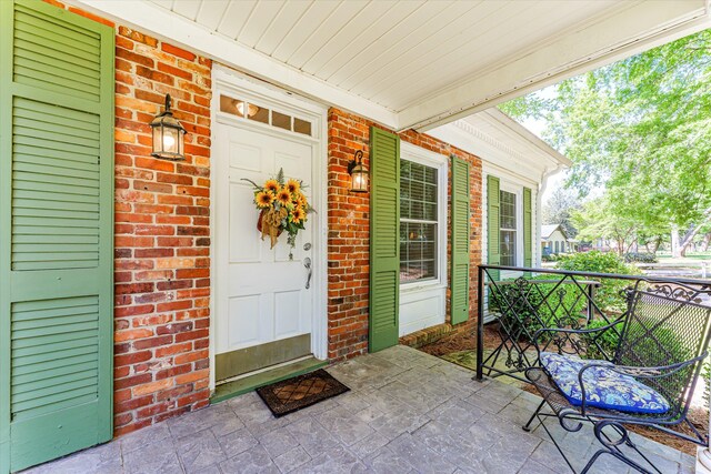 104 Sim St, Washington, GA 30673 - entrance to property featuring brick siding and covered porch