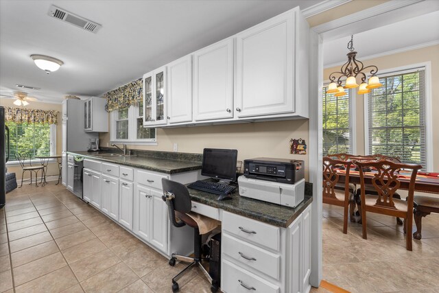 104 Sim St, Washington, GA 30673 - kitchen with light tile patterned floors, a sink, dark countertops, white cabinetry, and crown molding