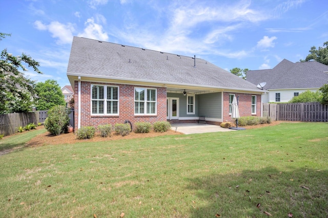 216 Dixon Ct, Evans, GA 30809 - rear view of house with brick siding, a patio, a fenced backyard, a ceiling fan, and roof with shingles