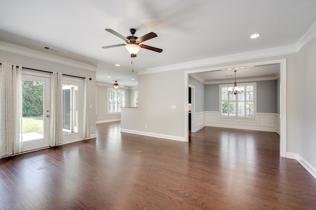 216 Dixon Ct, Evans, GA 30809 - unfurnished living room with a chandelier, ceiling fan, dark wood finished floors, wainscoting, and crown molding