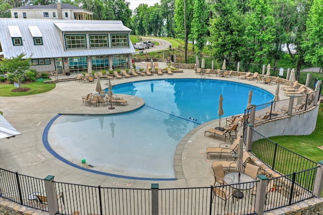 216 Dixon Ct, Evans, GA 30809 - community pool with a patio and view of scattered trees