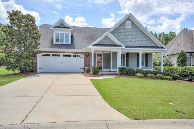 216 Dixon Ct, Evans, GA 30809 - craftsman house with a front lawn, a porch, driveway, roof with shingles, and brick siding