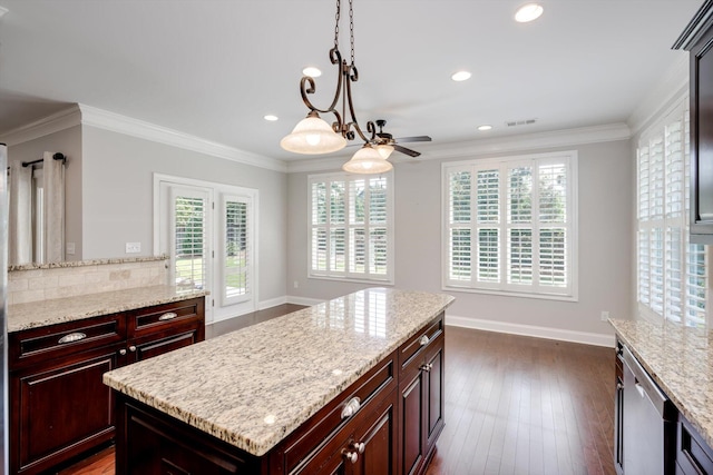 216 Dixon Ct, Evans, GA 30809 - kitchen featuring a kitchen island, stainless steel dishwasher, healthy amount of natural light, a ceiling fan, and ornamental molding