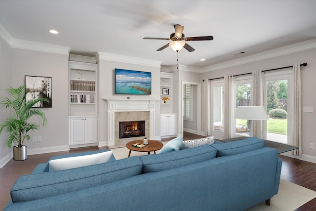 216 Dixon Ct, Evans, GA 30809 - living area with ceiling fan, a high end fireplace, dark wood-style floors, built in features, and crown molding