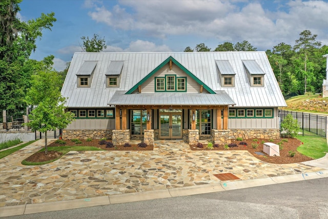 216 Dixon Ct, Evans, GA 30809 - view of front of house with french doors, board and batten siding, stone siding, and a metal roof