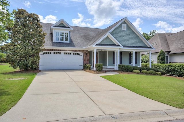 216 Dixon Ct, Evans, GA 30809 - view of front of home with covered porch, a front yard, concrete driveway, roof with shingles, and an attached garage