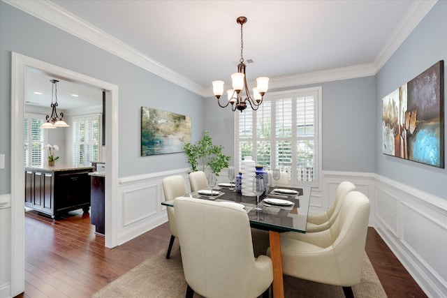 216 Dixon Ct, Evans, GA 30809 - dining room featuring ornamental molding, a wainscoted wall, a decorative wall, a chandelier, and dark wood-style floors