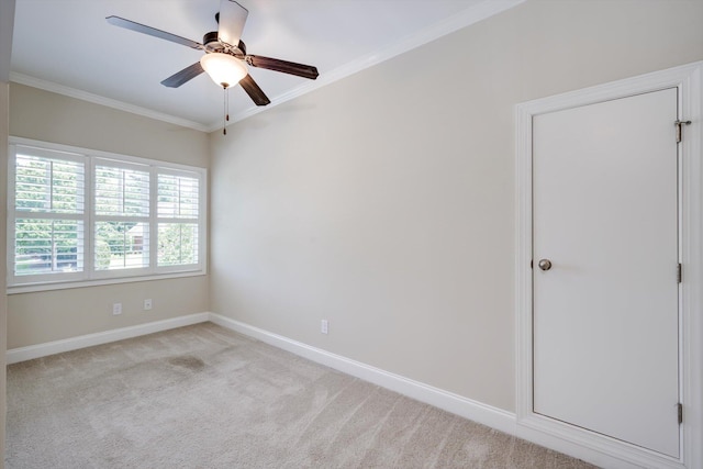 216 Dixon Ct, Evans, GA 30809 - spare room featuring a ceiling fan, crown molding, and carpet