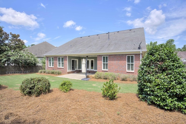 216 Dixon Ct, Evans, GA 30809 - back of house with brick siding, a patio area, and roof with shingles