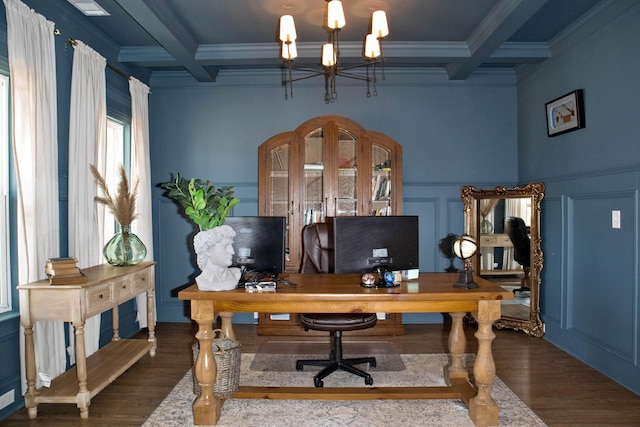 home office featuring beam ceiling, a decorative wall, coffered ceiling, and wood finished floors