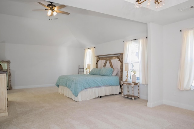 carpeted bedroom with lofted ceiling, baseboards, visible vents, and a chandelier