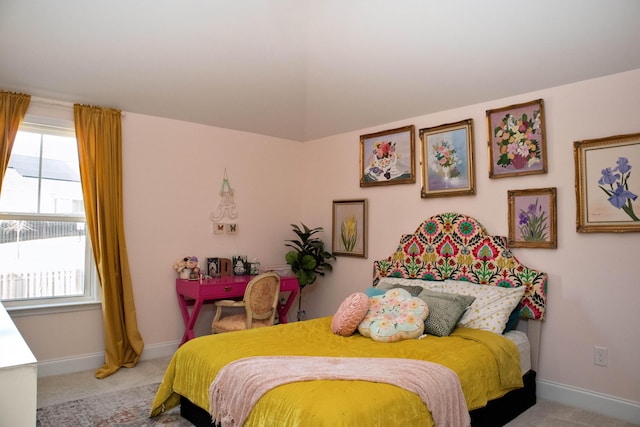 carpeted bedroom with baseboards