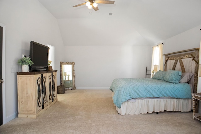 carpeted bedroom with lofted ceiling, baseboards, and ceiling fan