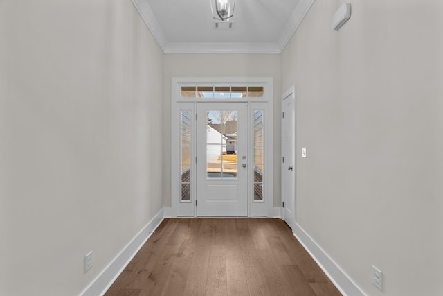 entryway featuring wood-type flooring and ornamental molding