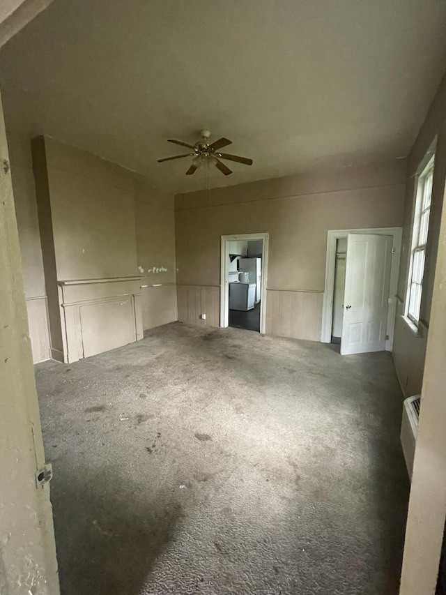210-212 Perkins St, Augusta, GA 30904 - unfurnished room featuring carpet flooring, a ceiling fan, and a wall unit AC