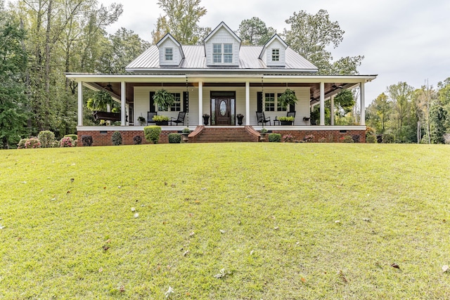 farmhouse inspired home with a porch and a front lawn