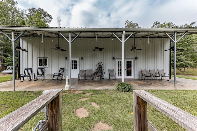 back of house featuring a yard, ceiling fan, french doors, and a patio