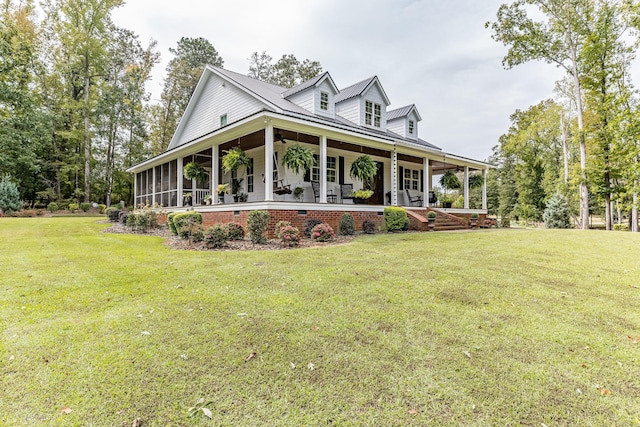 view of front facade with covered porch and a front lawn