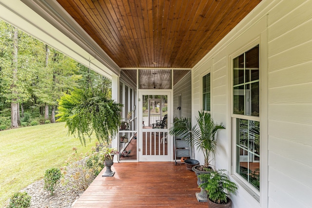 wooden terrace with a yard