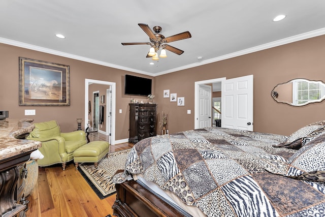 bedroom featuring ceiling fan, light hardwood / wood-style floors, and ornamental molding