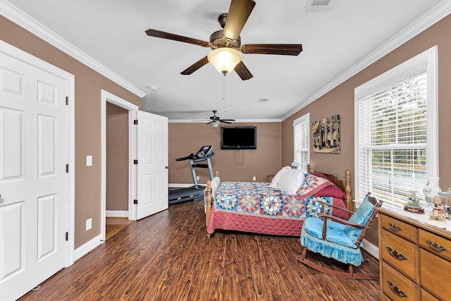 bedroom featuring dark hardwood / wood-style flooring, ceiling fan, and ornamental molding