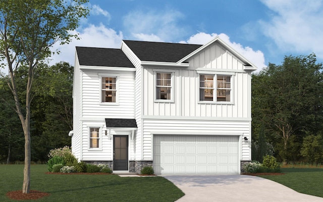 view of front of house featuring a front yard and a garage