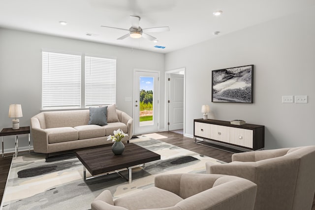 living room with ceiling fan and hardwood / wood-style floors