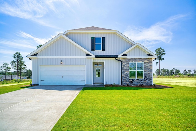 670 Jet Pass, Beech Island, SC 29842 - view of front facade featuring a front yard, concrete driveway, stone siding, board and batten siding, and an attached garage