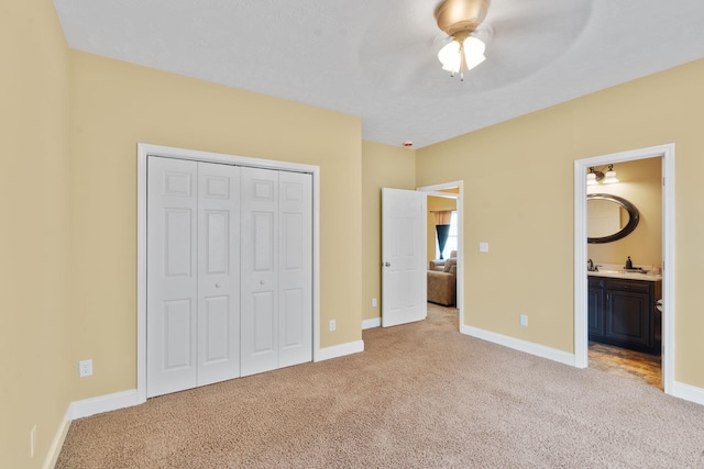3044 Rockwell Ct, Graniteville, SC 29829 - unfurnished bedroom with light carpet, a closet, connected bathroom, and a ceiling fan