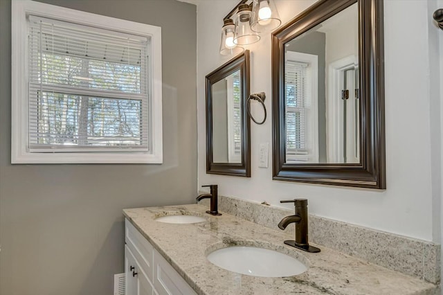 bathroom featuring double vanity and a sink