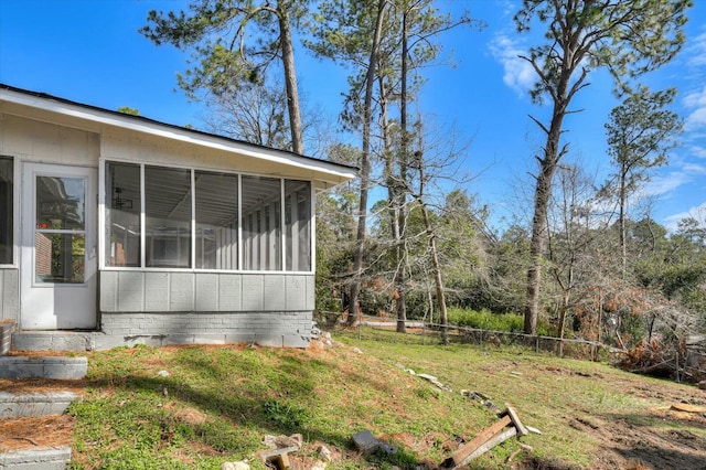 view of yard featuring a sunroom