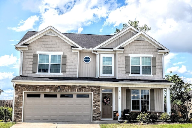 3113 Lobella Dr, Grovetown, GA 30813 - craftsman-style home featuring concrete driveway, a garage, a porch, and board and batten siding
