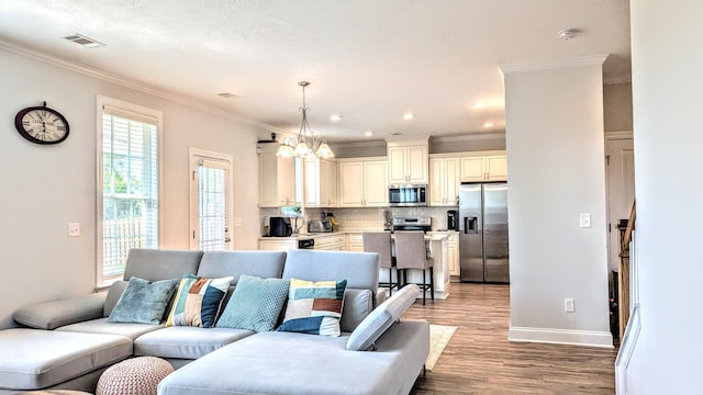 3113 Lobella Dr, Grovetown, GA 30813 - living area featuring light wood-type flooring, a chandelier, ornamental molding, and recessed lighting