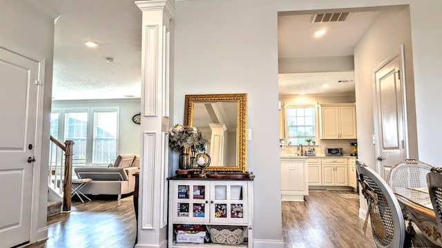 3113 Lobella Dr, Grovetown, GA 30813 - hall featuring healthy amount of natural light, crown molding, light wood-style flooring, stairway, and recessed lighting