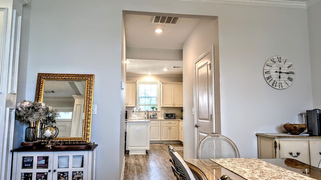 3113 Lobella Dr, Grovetown, GA 30813 - kitchen with wood finished floors, backsplash, crown molding, and light countertops