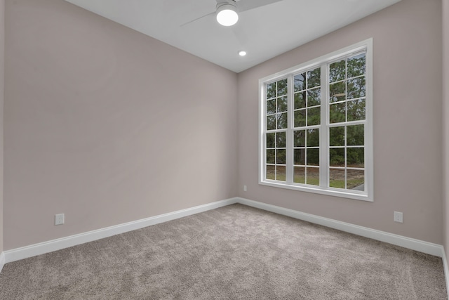 spare room with carpet flooring and ceiling fan