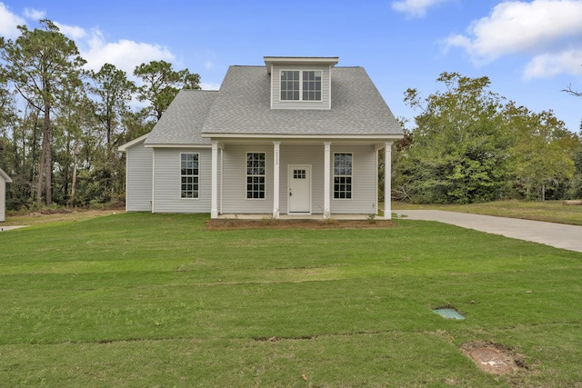 view of front of home with a porch and a front yard