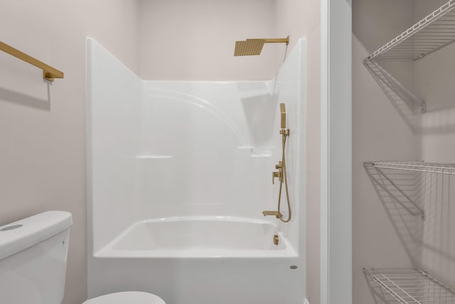 bathroom with shower / bath combination and toilet