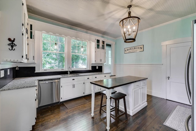 413 S Liberty St, Waynesboro, GA 30830 - kitchen with dishwasher, a sink, white cabinets, crown molding, and dark wood-type flooring